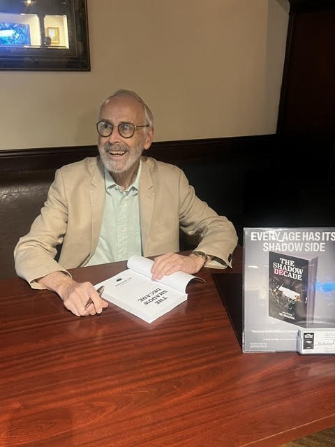 Mel Bradshaw signs copies of The Shadow Decade at the book's Toronto launch